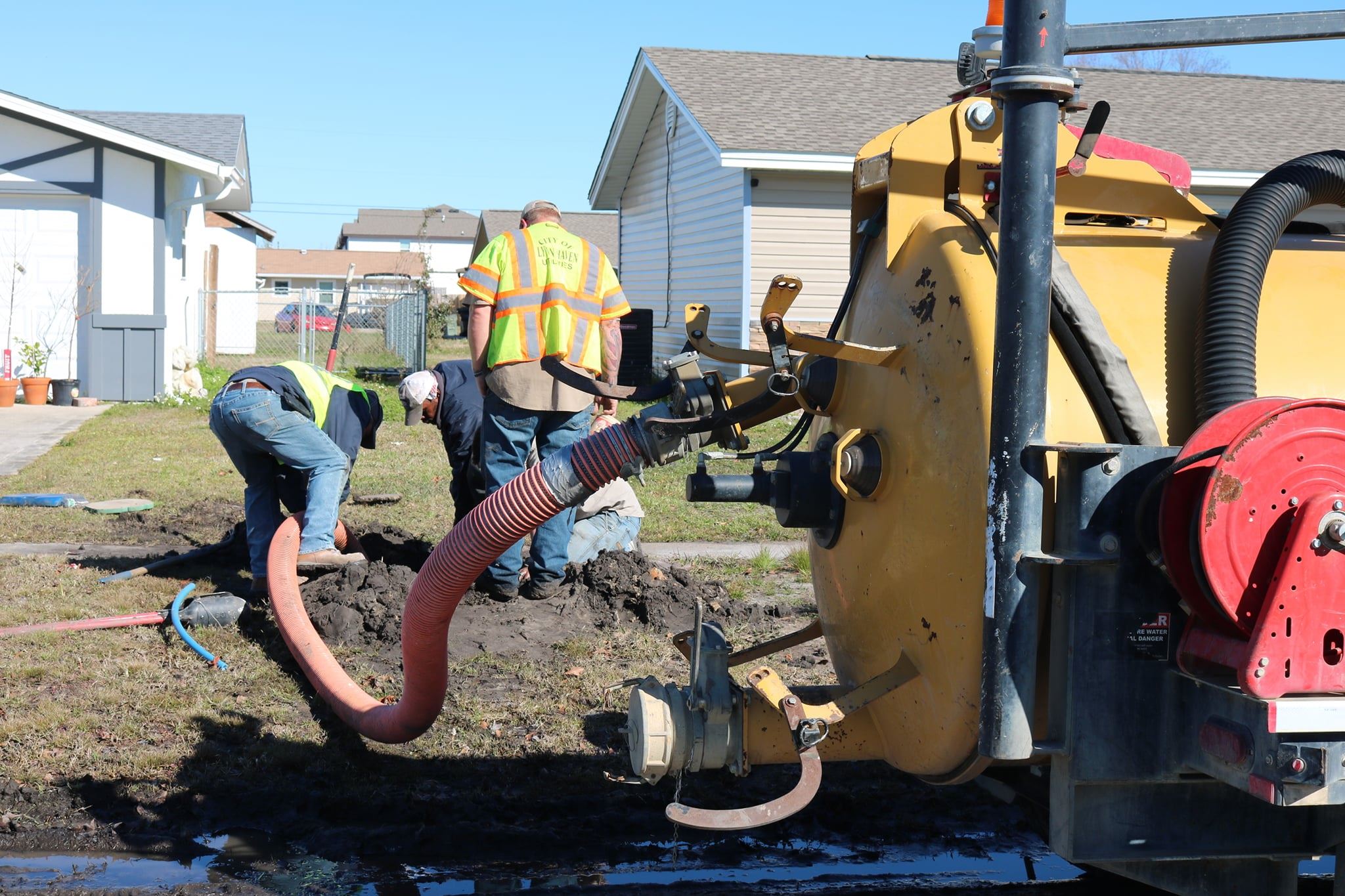Employees Cleaning Pipes